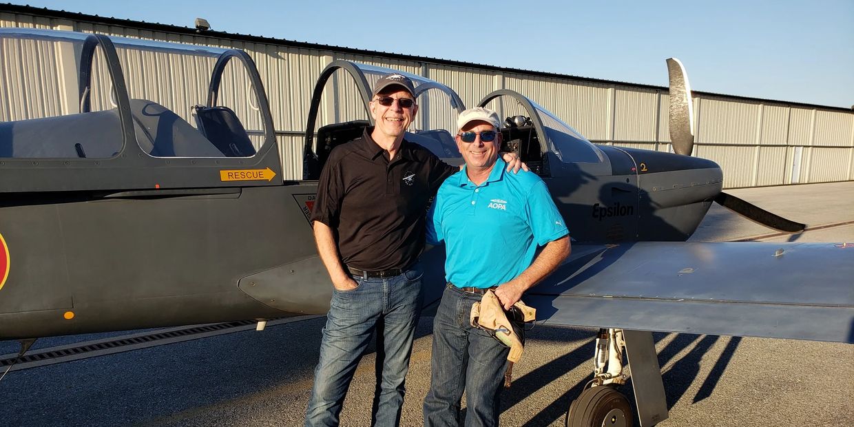 AOPA's Dave Hirschman and me after an afternoon of aerobatics in Mike Filucci's sweet Epsilson.  A m