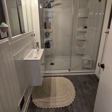 Full bathroom reno from tub to shower, mini sink.