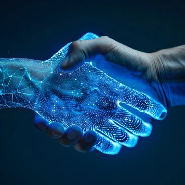 Close-up image of a digital and human handshake.