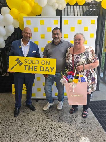Real estate agent, Levani Lum-On with his happy clients after selling at auction on THE DAY 8.0