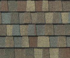 Golden Harvest: Close-up of GAF Golden Harvest shingles in warm gold and amber hues, evoking autumn.
