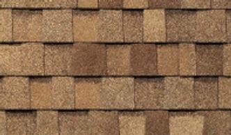 TAMKO Heritage shingles in Rustic Cedar, featuring warm, wood-inspired tones, dimensional design.