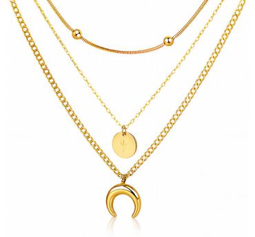 Three layered gold necklaces with unique pendants and chain designs.