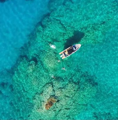 the only way to see Chania's stunning coastline and turquoise water is by boat