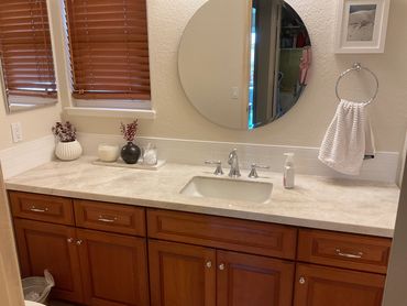 This was a partial remodel that included a Taj Mahal countertop, backsplash and paint color.