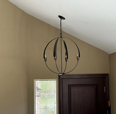 This light is a smaller version of the chandelier on the staircase. They look beautiful together.