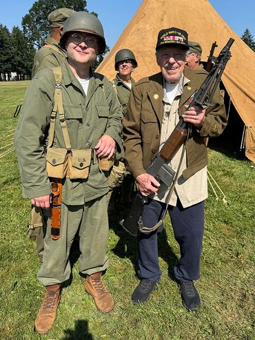 WWII Living History Encampment at Ft Vancouver holding a BAR like the one I carried during the war.