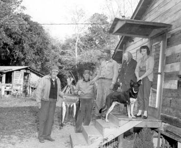 The Odulund family and others outside their home on Odulund Island near Suwannee