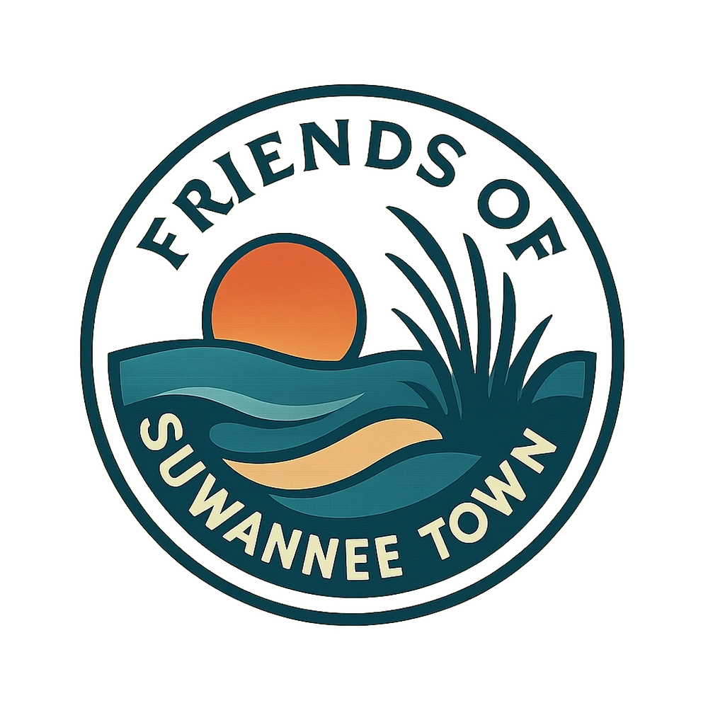 Stack of books next to pencils in a holder and a camera.