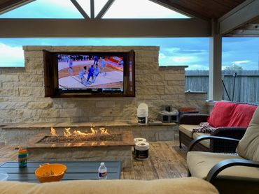 Luxurious fireplace patio designed by The Patio Kings