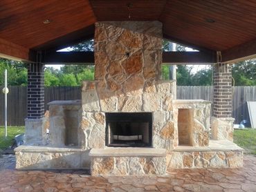 Luxurious fireplace patio designed by The Patio Kings