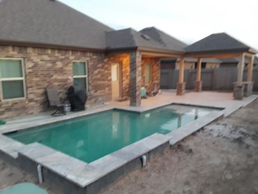 Luxurious pool with cabana designed by The Patio Kings