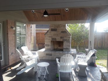 Spacious fireplace patio designed by The Patio Kings