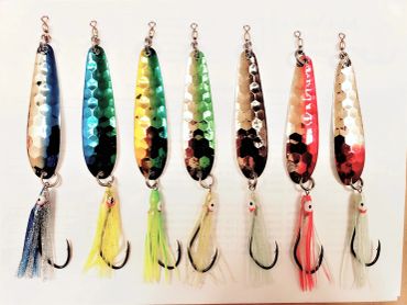 Set of colorful fishing lures with hooks.