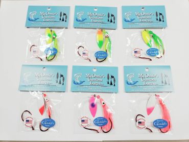 Fishing lures in clear plastic packaging from McOmie's Custom Lures.