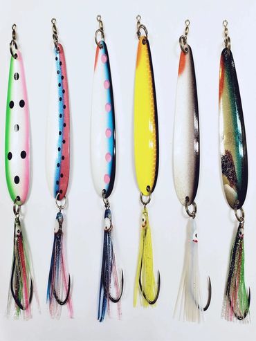 Colorful fishing lures with hooks and streamers.