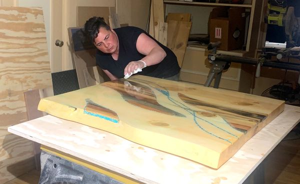 Alex Allington at work making hand made, custom, live edge, inlay table.