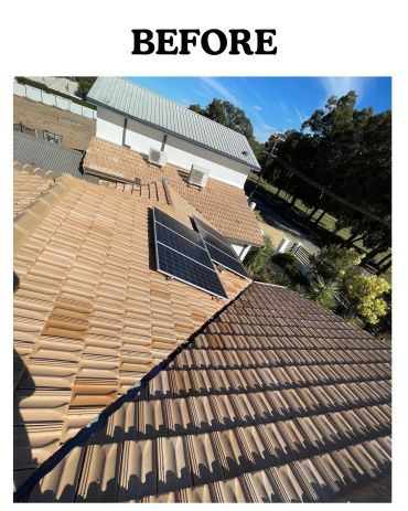 Solar panels on a rooftop before cleaning.