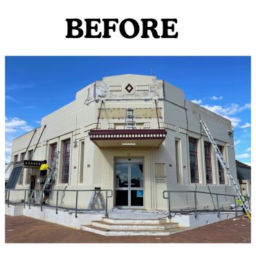 Old building undergoing exterior repair work.