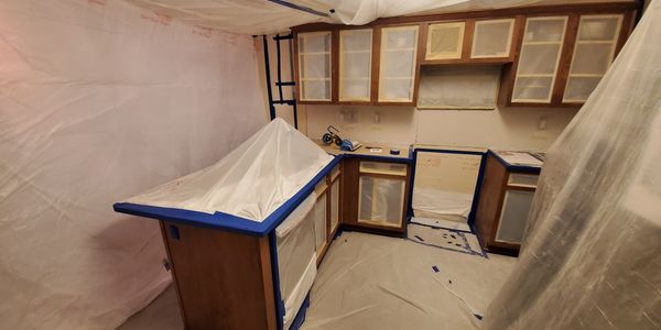kitchen cabinets walls and floor masked off