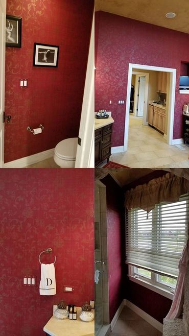 Elegant bathroom with rich red wallpaper and classic decor accents.
