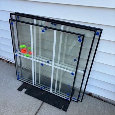 Double pane window glass waiting for installation. Window repair serviced near me in Bellevue, WI