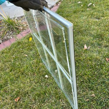 Seal failure glass replacement near me in Ashwaubenon, WI. Window repair service for wood window.