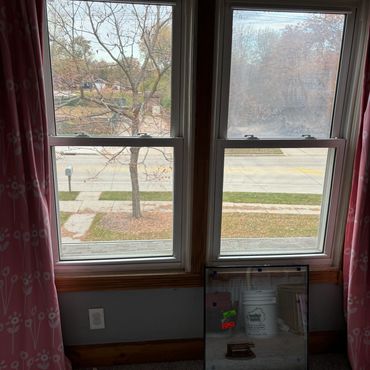 Seal failure glass replacement near me in Ashwaubenon, WI. Window repair serviced on vinyl window.