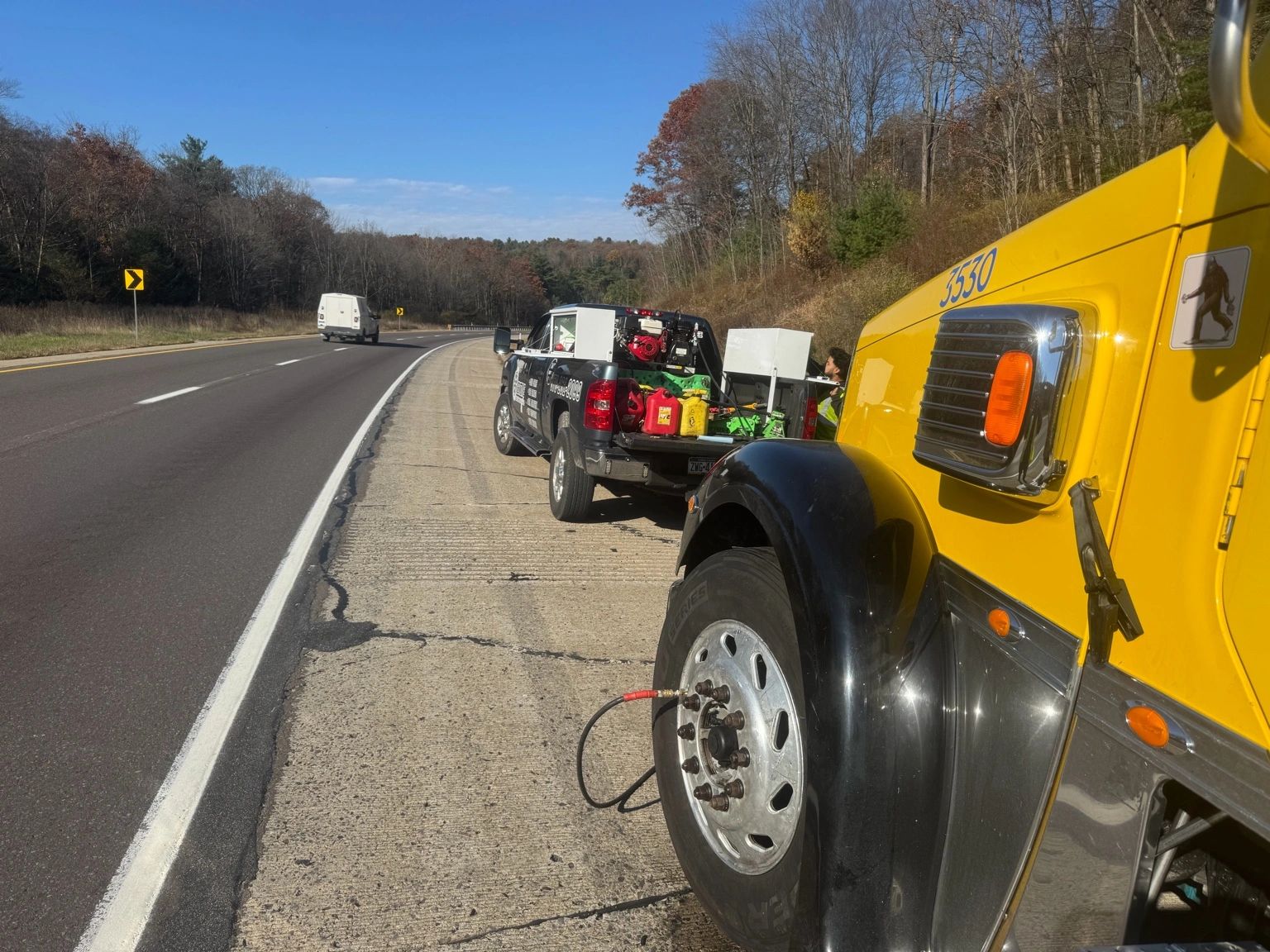 Highway roadside assistance for a commercial truck tire issue.