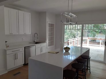 Eat In Kitchen With Custom Sliding Waterfall Edge Island Top, New Cabinets, Flooring and Fixtures