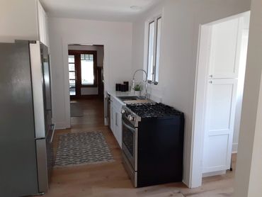 Galley Kitchen with New Flooring, Appliances, Cabinets and Sink