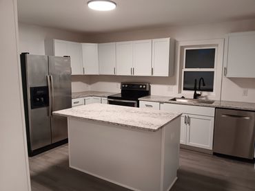 Complete Kitchen Remodel from the studs. New Cabinets, Quartz countertops and new windows