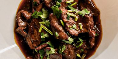 Manchurian Beef served on a plate.
