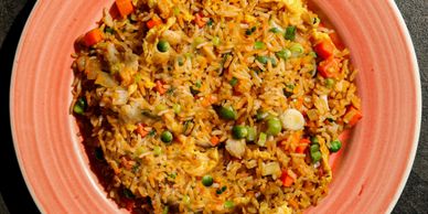 Fried rice served on a plate.
