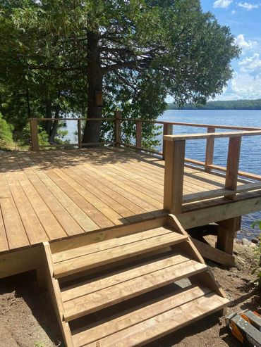custom deck overhanging a lake in Port Loring Ontario