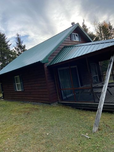 steel roof installation on older cabin