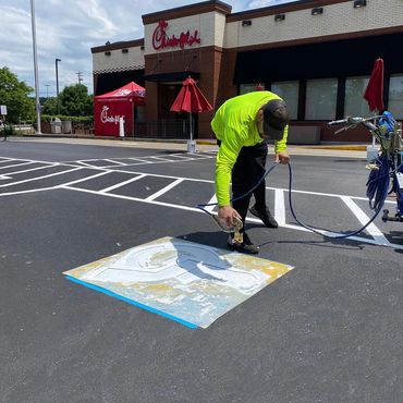 painting Parking lot ADA symbol