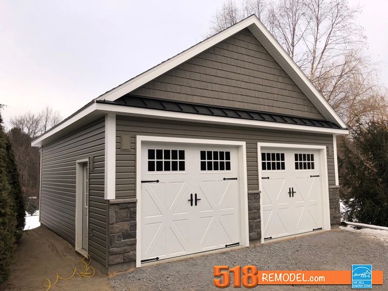 Two car garage with side entry door. Custom stone work.