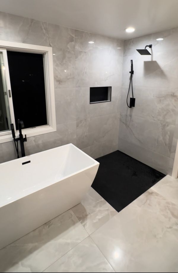 Free standing tub and curb less shower