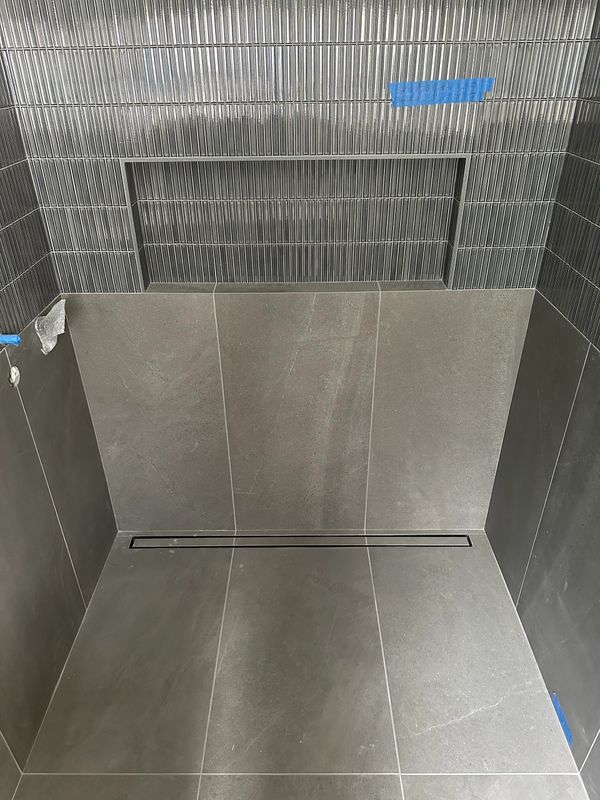 Cub less shower with linear drain