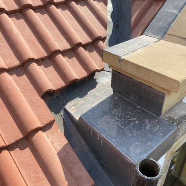 example of intricate lead work on tiled domestic roof