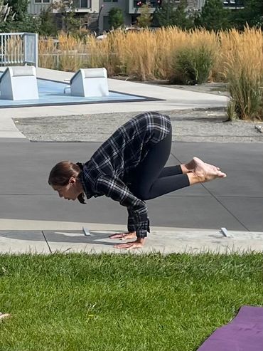 Debbie demonstrating a pose at Yoga in the Park, in Littleton