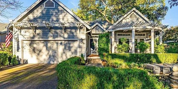 A wooden house with the garage