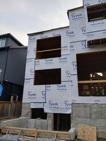 New house under construction with Tyvek wrap.