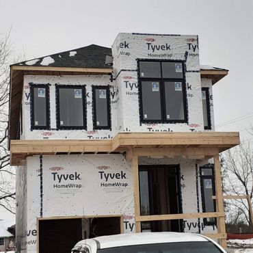 Tyvek wrap and window taping.
