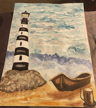 Brown boat docked on the sand in front of a white and black lighthouse. Sea and sky in background.