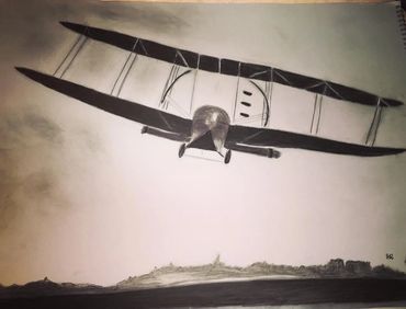 Charcoal piece with an old by-plane flying over hills.