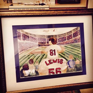Framed custom piece of little boy on his dads shoulders at a baseball game. Shows backside jerseys.
