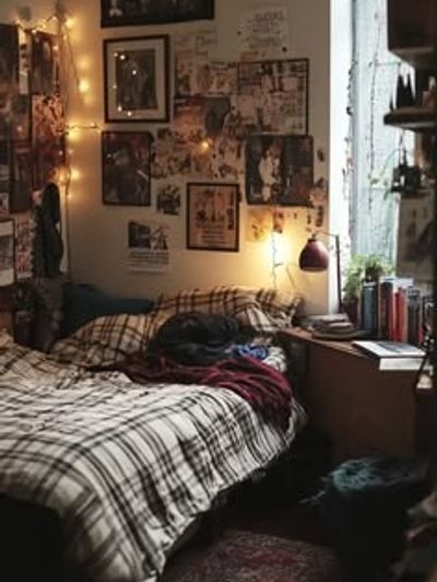 Cozy bedroom with string lights and plaid bedding.