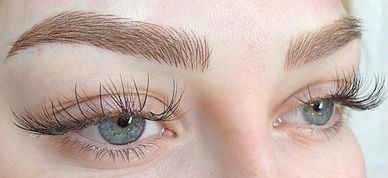 a close-up photo of a women's eyebrow tattooing/ microblading, hair strokes tattoo.